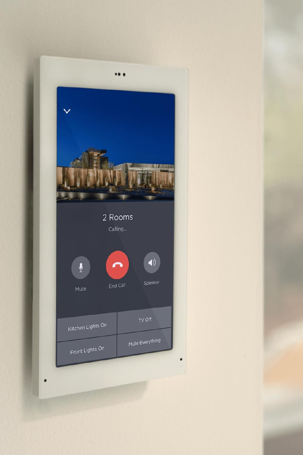 Wall-mounted touchscreen interface displaying home automation controls